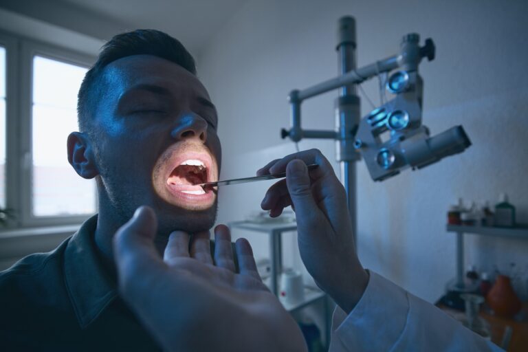 Dentist performing a comprehensive dental exam on a patient at Reston Serenity Smiles in Reston VA
