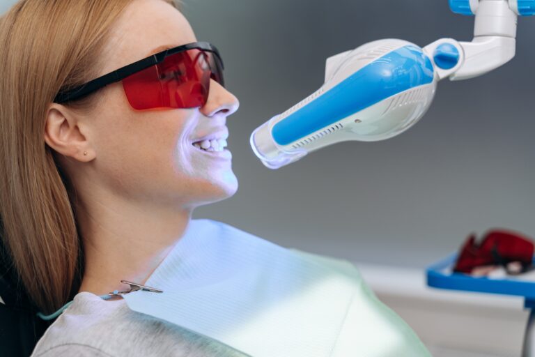 Dentist discussing professional teeth whitening with a patient at Reston Serenity Smiles in Reston VA